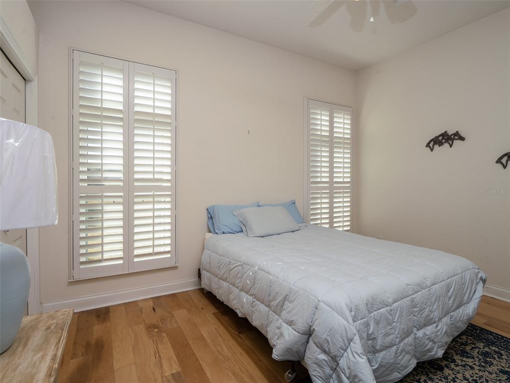 2185 Northwest 114th Loop Ocala, FL 34475 - Photo 13 of 25 a bedroom with a bed and a window