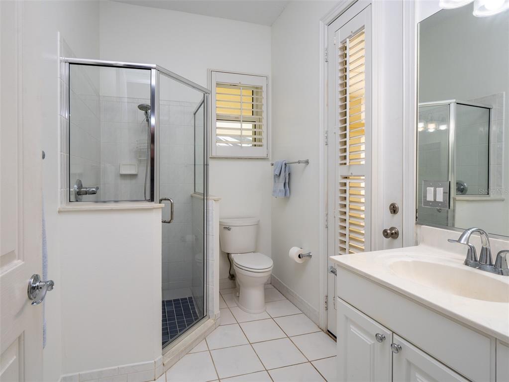 2185 Northwest 114th Loop Ocala, FL 34475 - Photo 15 of 25 a bathroom with a granite countertop sink toilet and shower