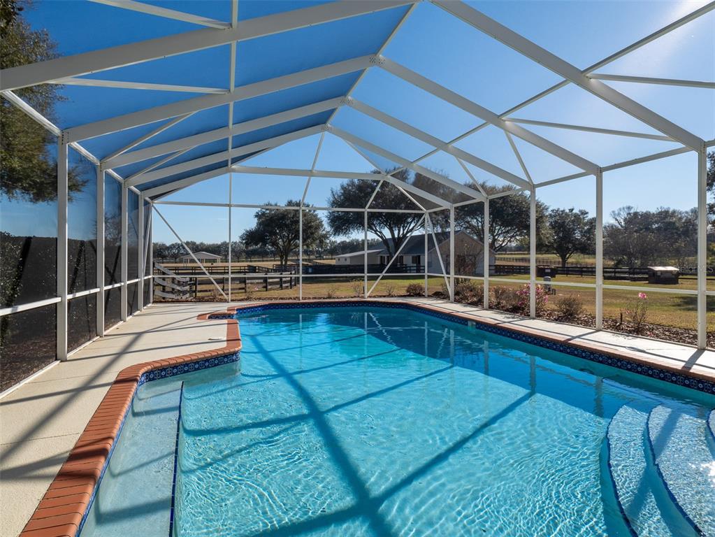 2185 Northwest 114th Loop Ocala, FL 34475 - Photo 17 of 25 a view of outdoor space with porch and wooden floor