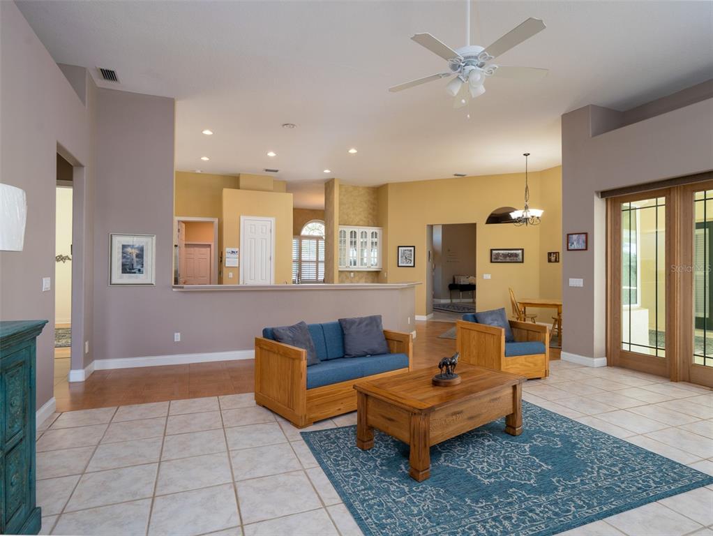 2185 Northwest 114th Loop Ocala, FL 34475 - Photo 5 of 25 a living room with furniture and a rug
