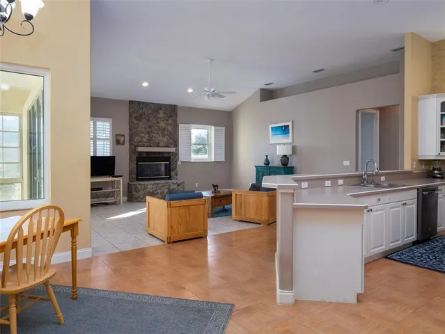 a living room with granite countertop furniture and fireplace