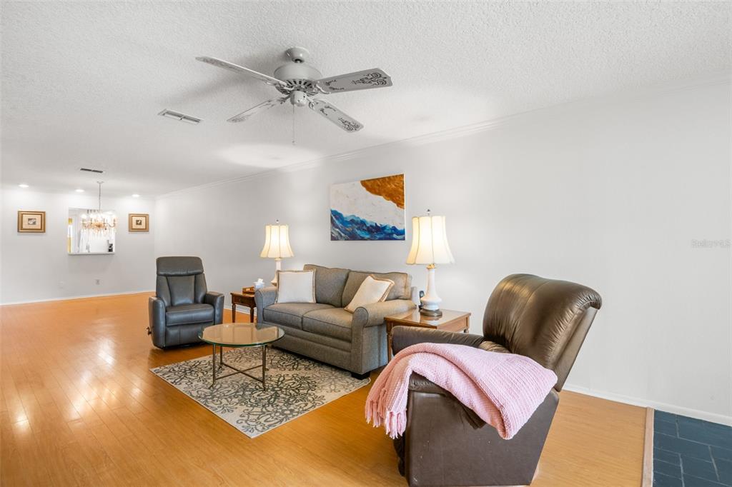 1012 Dunrobin Drive, Unit D Palm Harbor, FL 34684 - Photo 19 of 61 a living room with furniture and a rug