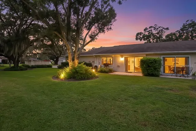 a view of a house with a back yard