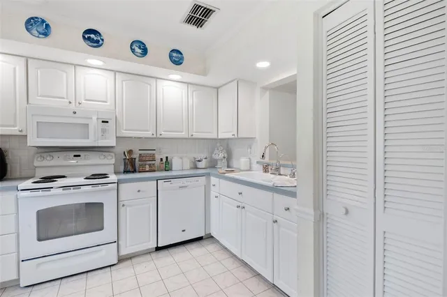 a bedroom with a bed and flat screen tv