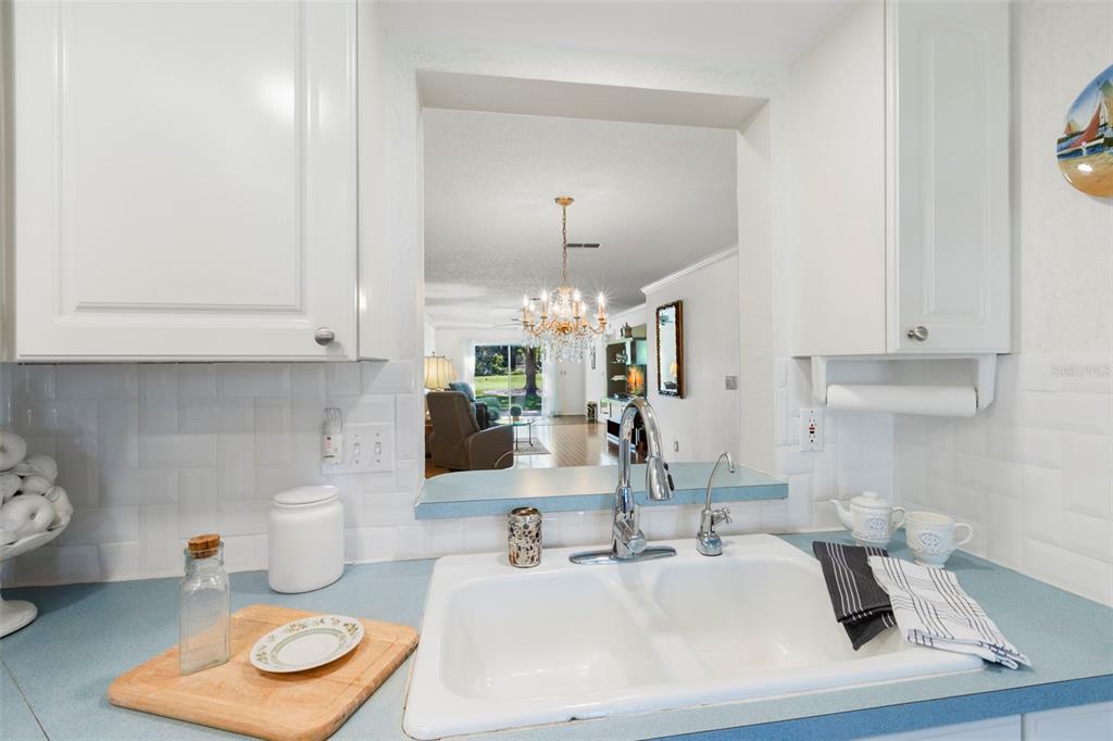 1012 Dunrobin Drive, Unit D Palm Harbor, FL 34684 - Photo 27 of 61 a bathroom with a sink and a mirror