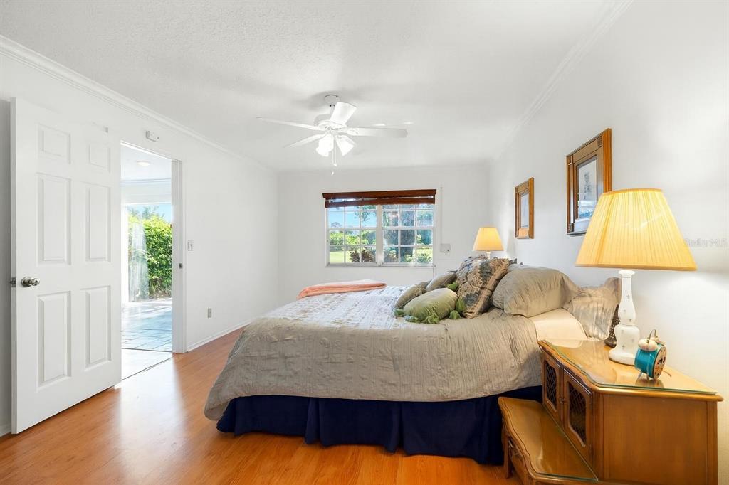 1012 Dunrobin Drive, Unit D Palm Harbor, FL 34684 - Photo 29 of 61 a bedroom with a bed and a window