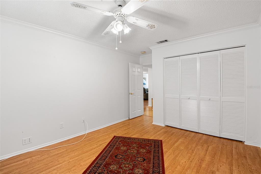 1012 Dunrobin Drive, Unit D Palm Harbor, FL 34684 - Photo 35 of 61 wooden floor in an empty room with a window