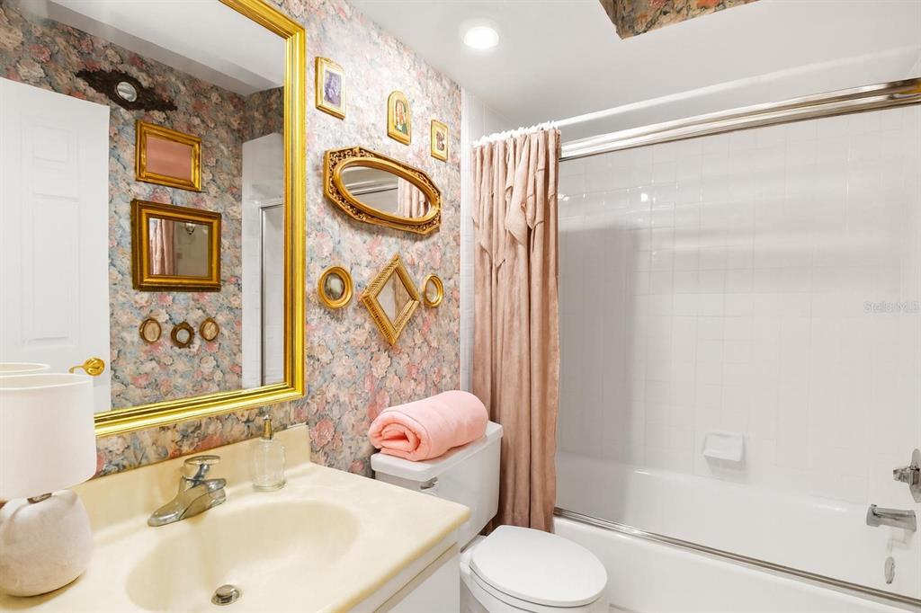 1012 Dunrobin Drive, Unit D Palm Harbor, FL 34684 - Photo 37 of 61 a bathroom with a sink toilet and shower