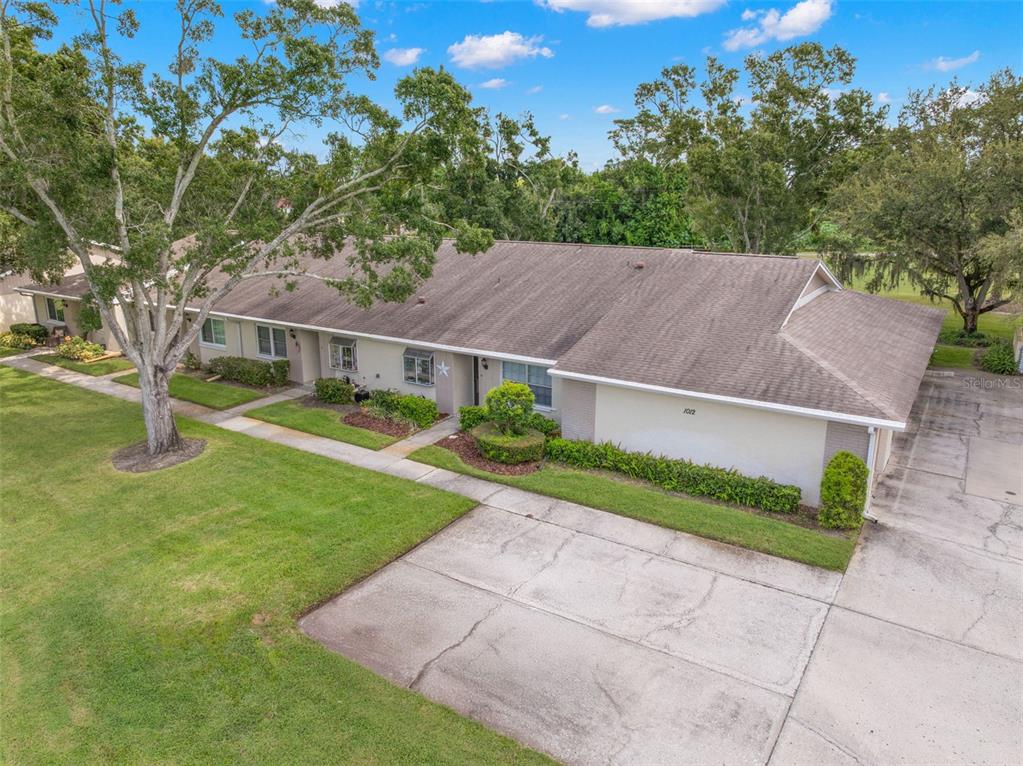 1012 Dunrobin Drive, Unit D Palm Harbor, FL 34684 - Photo 41 of 61 a view of house with outdoor space and street view