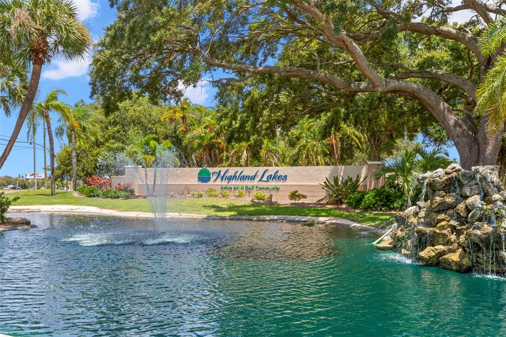 1012 Dunrobin Drive, Unit D Palm Harbor, FL 34684 - Photo 50 of 61 a view of a swimming pool with a yard