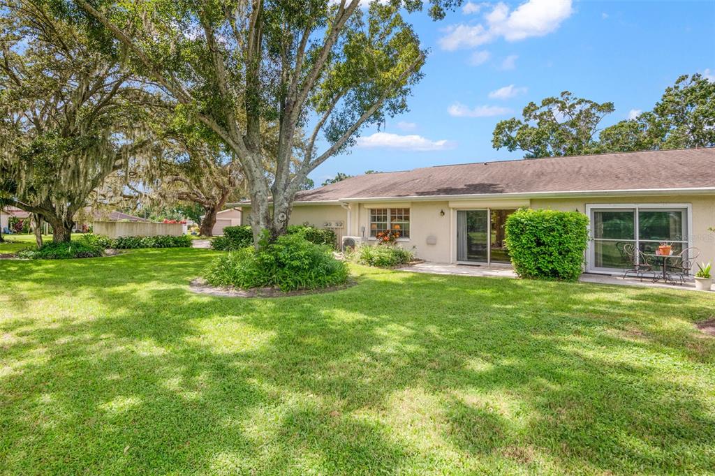1012 Dunrobin Drive, Unit D Palm Harbor, FL 34684 - Photo 6 of 61 a front view of a house with a yard