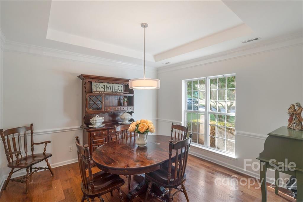 6647 Reedy Creek Road Charlotte, NC 28215 - Photo 4 of 26 a view of a dining room with furniture window and outside view