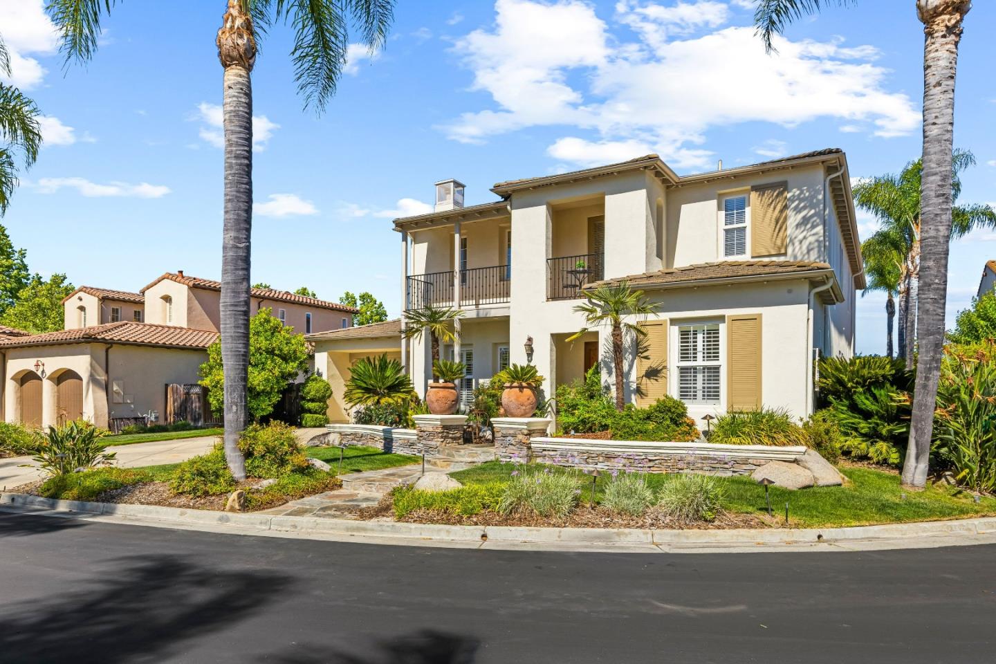 7466 Dunbar Court Gilroy, CA 95020 - Photo 3 of 103 a front view of a house with a garden and plants