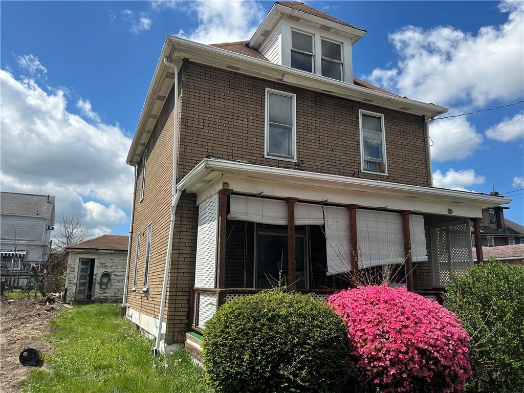 727 South 14th Street Monessen, PA 15062 - Photo 2 of 13 a front view of a house with a yard