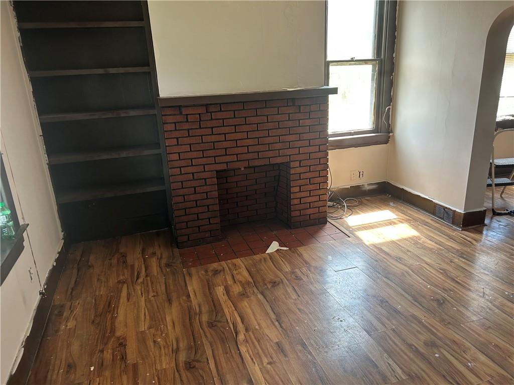 727 South 14th Street Monessen, PA 15062 - Photo 5 of 13 a view of an empty room with wooden floor and a window