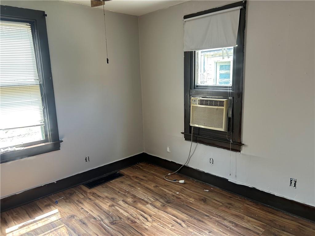 727 South 14th Street Monessen, PA 15062 - Photo 6 of 13 a view of empty room with wooden floor and fan