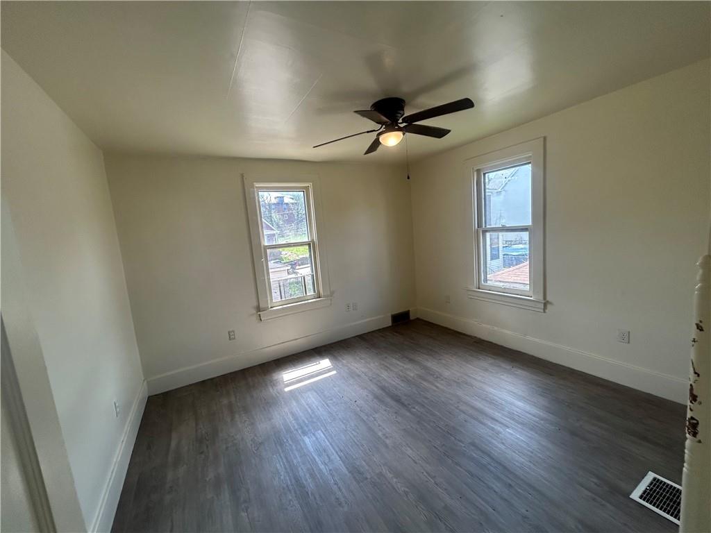 727 South 14th Street Monessen, PA 15062 - Photo 10 of 13 a view of empty room with wooden floor and fan