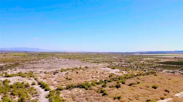 an aerial view of residential building and ocean