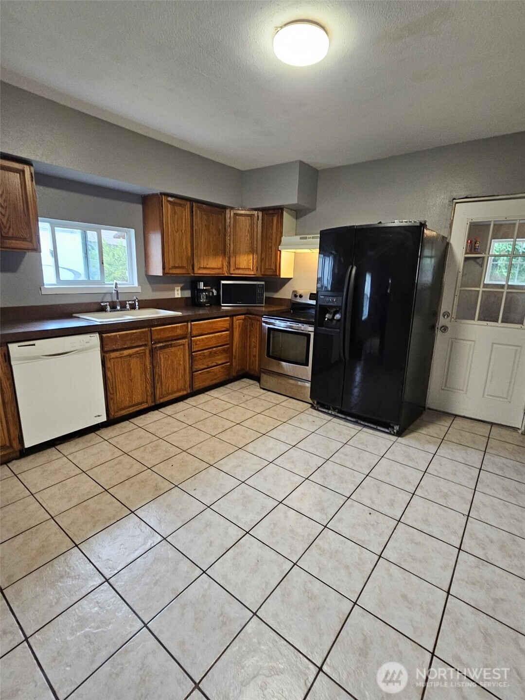 906 Southwest Mayer Street Winlock, WA 98596 - Photo 9 of 16 a kitchen with a cabinets and appliances