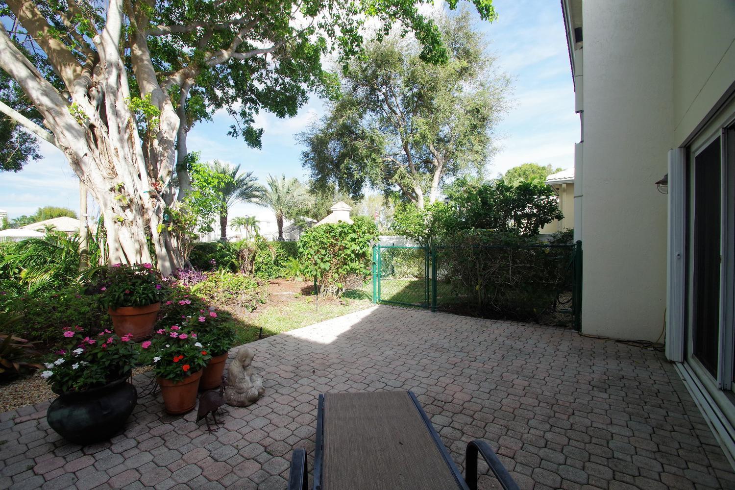 6535 Colomera Drive Boca Raton, FL 33433 - Photo 30 of 36 a view of a backyard with a garden