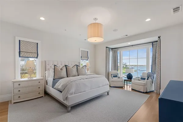 a bed room with a bed and a television