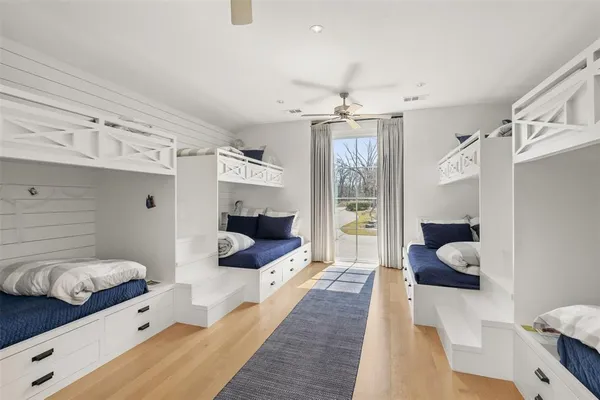 a spacious bedroom with a bed and a couch