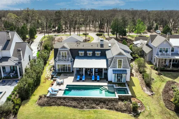 a view of a white house with a yard