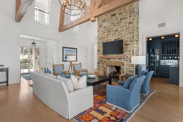 a living room with fireplace furniture and a fireplace