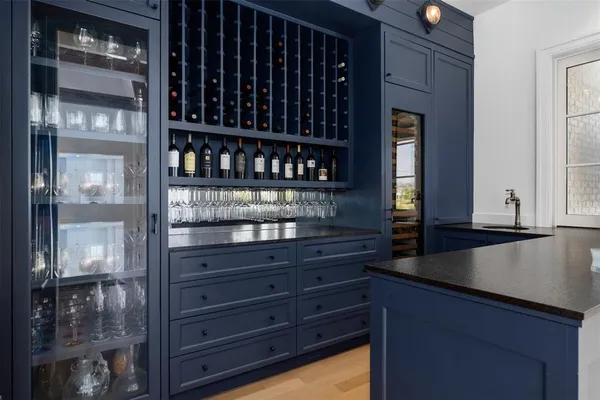 a kitchen with granite countertop a refrigerator and a stove