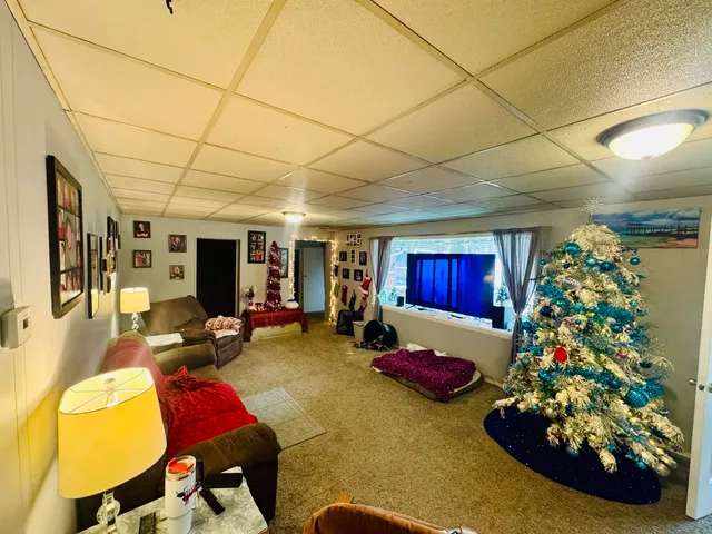 a living room with furniture and a rug