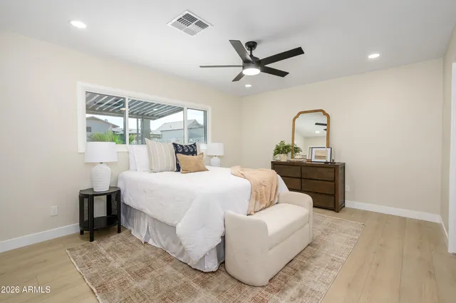 a bed room with a bed and a window