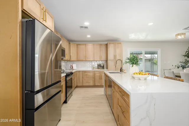 a kitchen with refrigerator and car