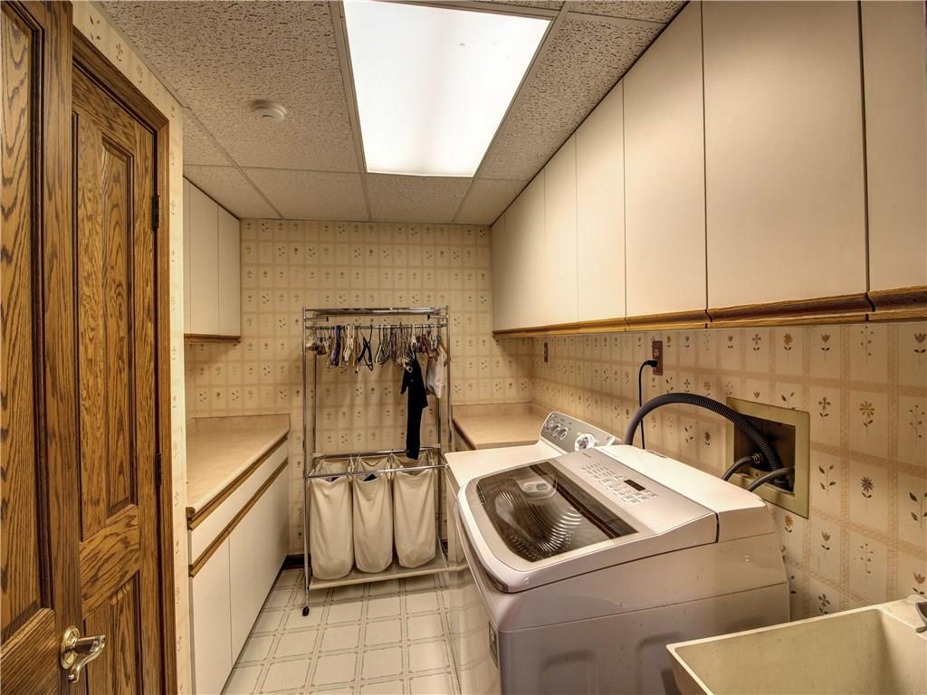 185 Thompson Road Beaver Falls, PA 15010 - Photo 13 of 25 This Laundry Room makes doing laundry a breeze! It has a folding counter, storage cabinets, newer washer, and closet.