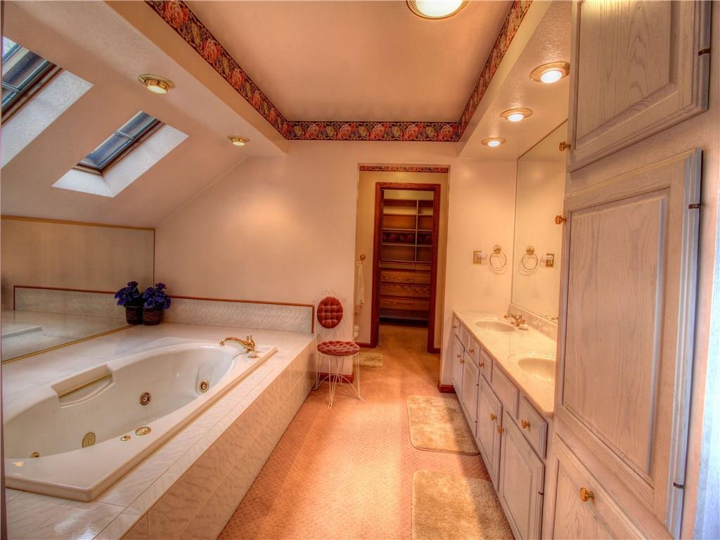 185 Thompson Road Beaver Falls, PA 15010 - Photo 18 of 25 King Size Bathroom with jet tub, double sinks, Skylights, Recessed Lighting and Huge walk-in closet/dressing room.