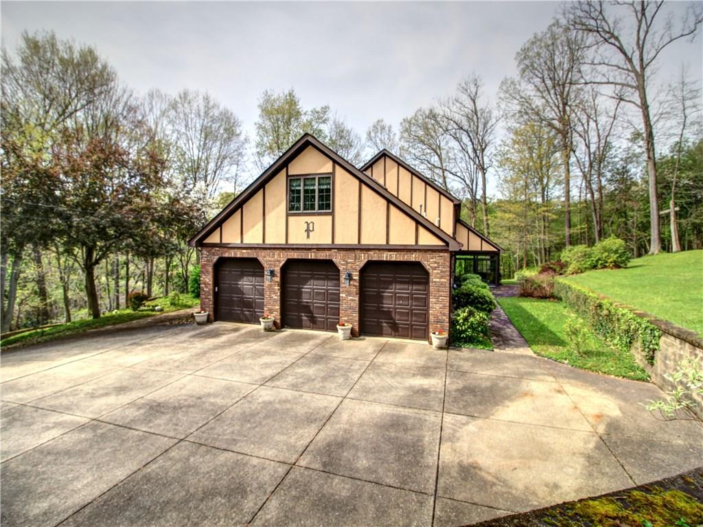 Spacious 3 Car Garage with room for bikes, tools and toys.