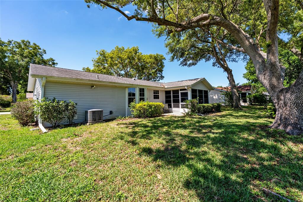 8038 Southwest 108th Loop Ocala, FL 34481 - Photo 35 of 48 a house view with a garden space