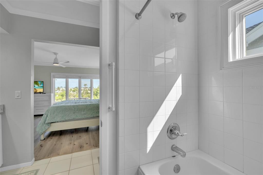 848 Evergreen Way Longboat Key, FL 34228 - Photo 20 of 66 a bathroom with a tub and sink