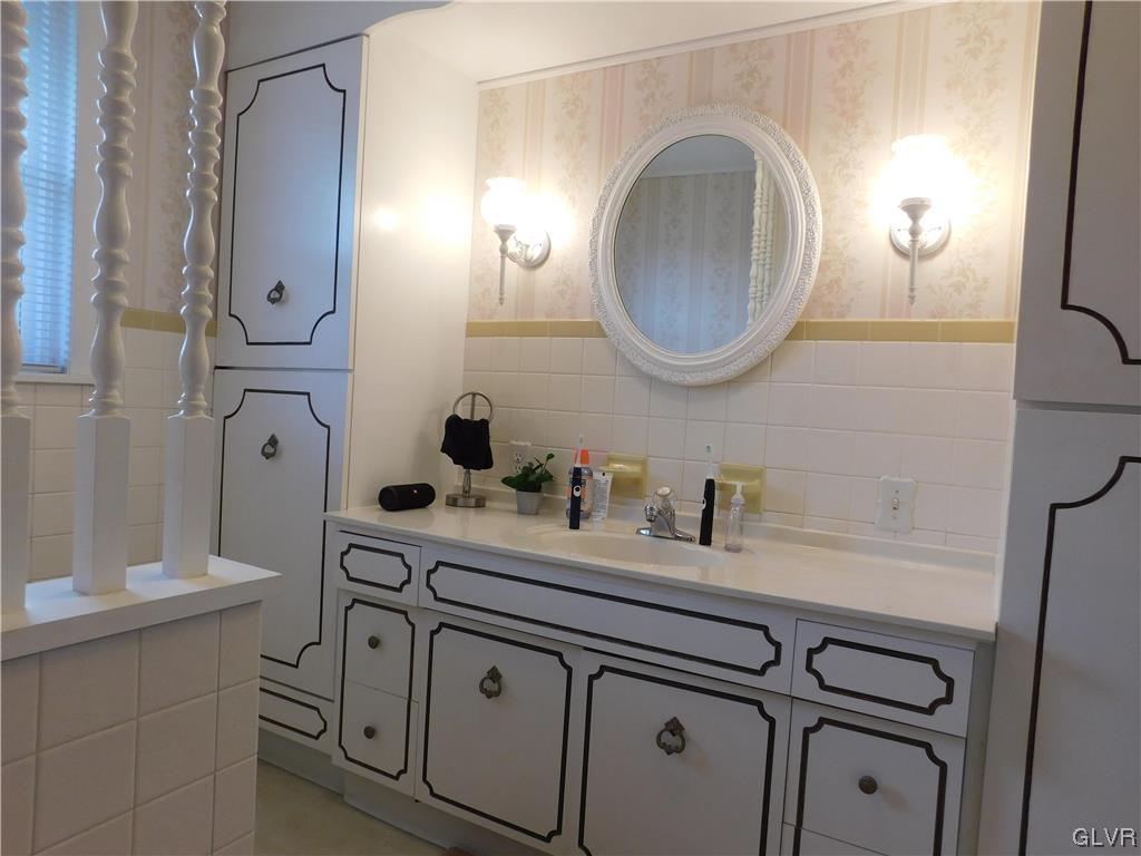 103 Fairview Avenue Wind Gap, PA 18091 - Photo 11 of 22 a bathroom with a sink vanity and mirror