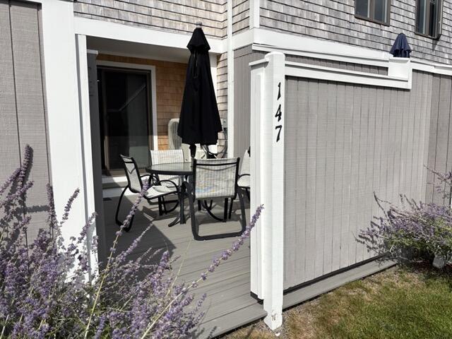 500 Ocean Street, Unit 147 Hyannis, MA 02601 - Photo 14 of 23 a view of a house with backyard and sitting area
