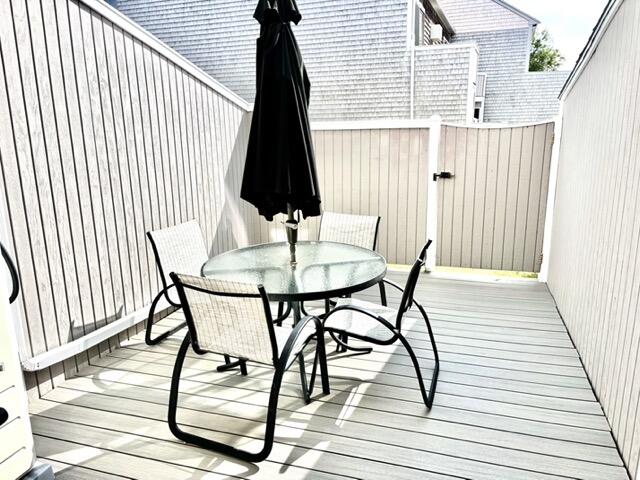 500 Ocean Street, Unit 147 Hyannis, MA 02601 - Photo 15 of 23 a view of balcony with wooden floor and outdoor seating