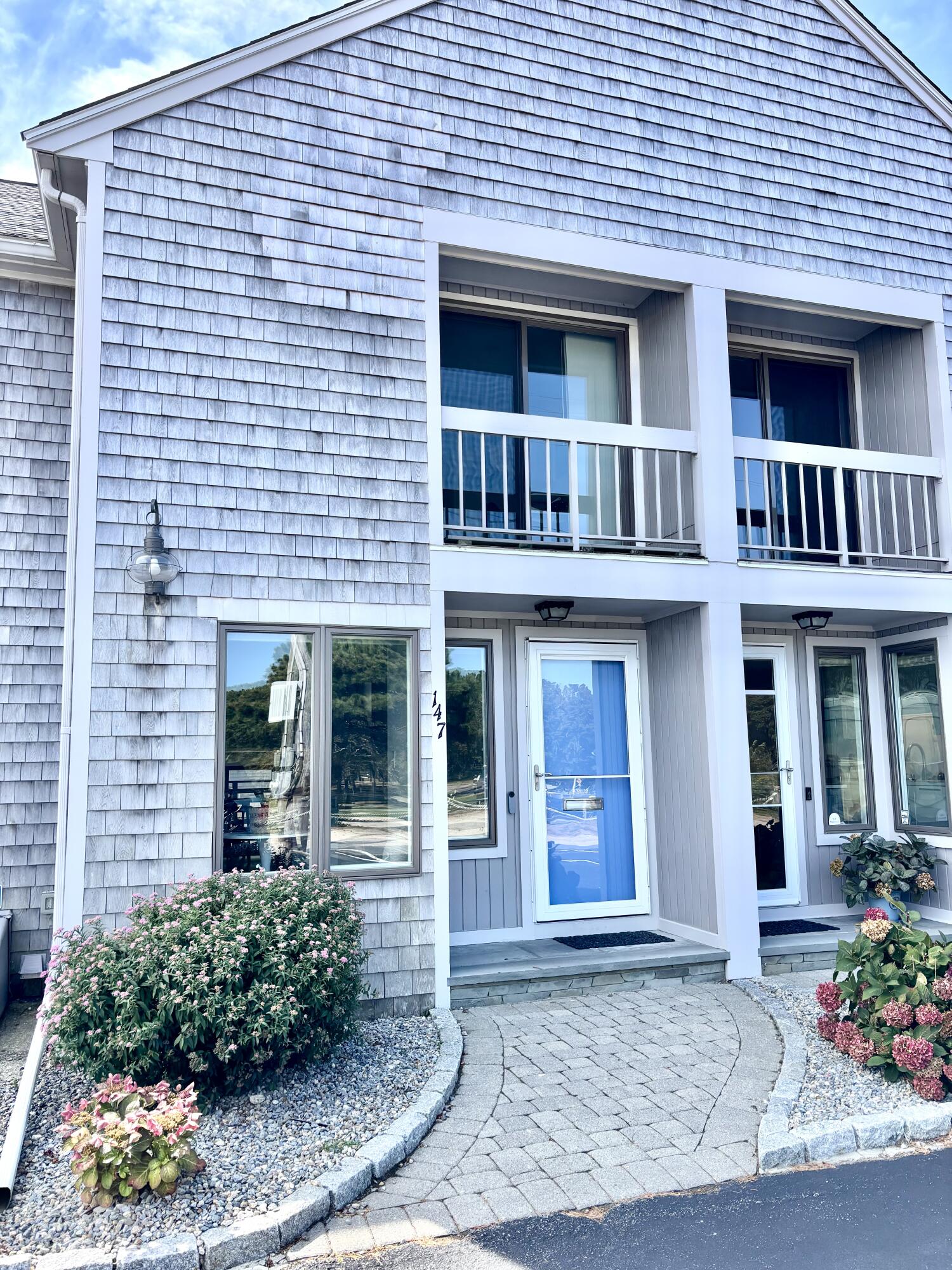 500 Ocean Street, Unit 147 Hyannis, MA 02601 - Photo 23 of 23 a view of a brick house with potted plants