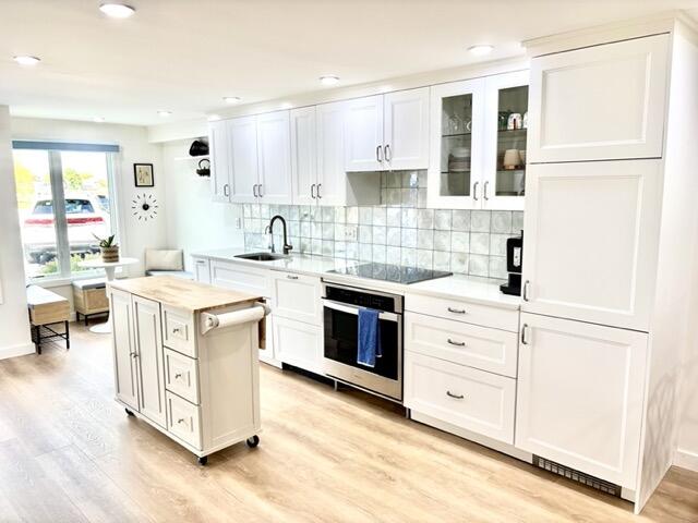 500 Ocean Street, Unit 147 Hyannis, MA 02601 - Photo 3 of 23 a kitchen with white cabinets and white appliances