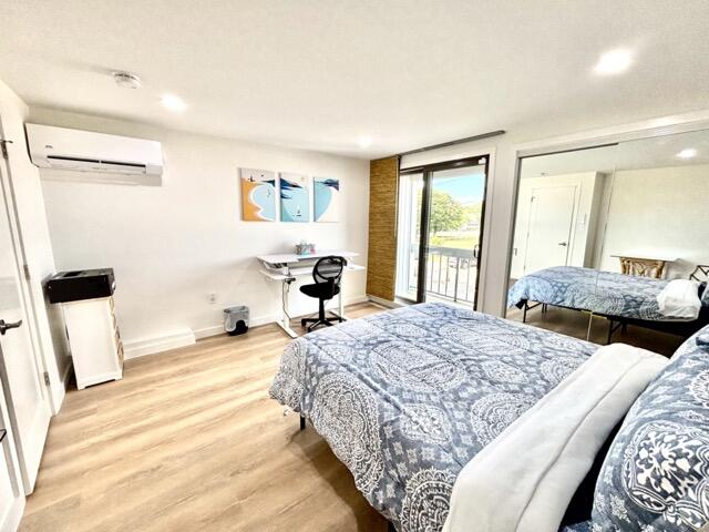 500 Ocean Street, Unit 147 Hyannis, MA 02601 - Photo 10 of 23 a bedroom with a bed and a large mirror on the dresser