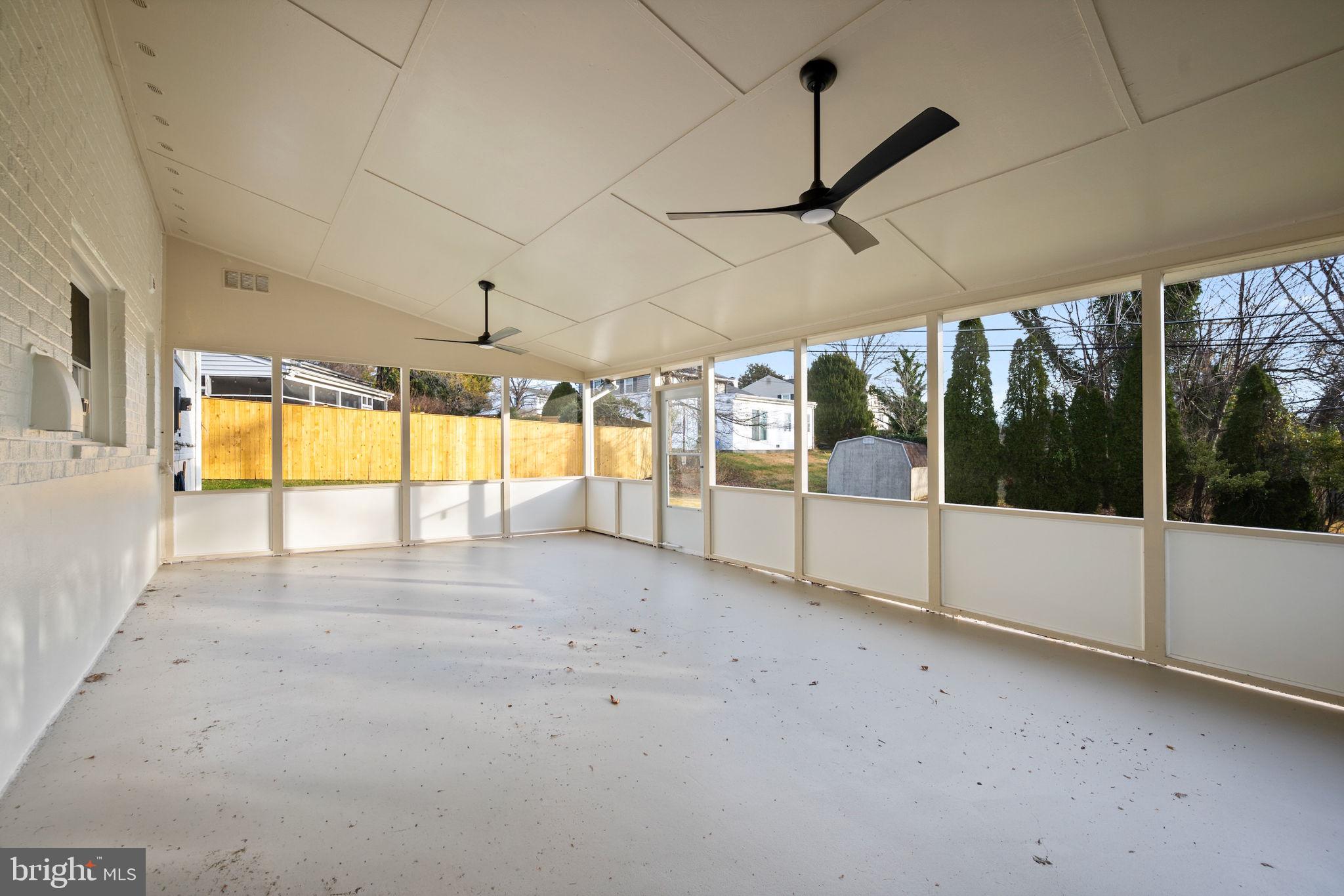 2111 Eastridge Road Lutherville-Timonium, MD 21093 - Photo 14 of 45 a view of an empty room with a sliding door