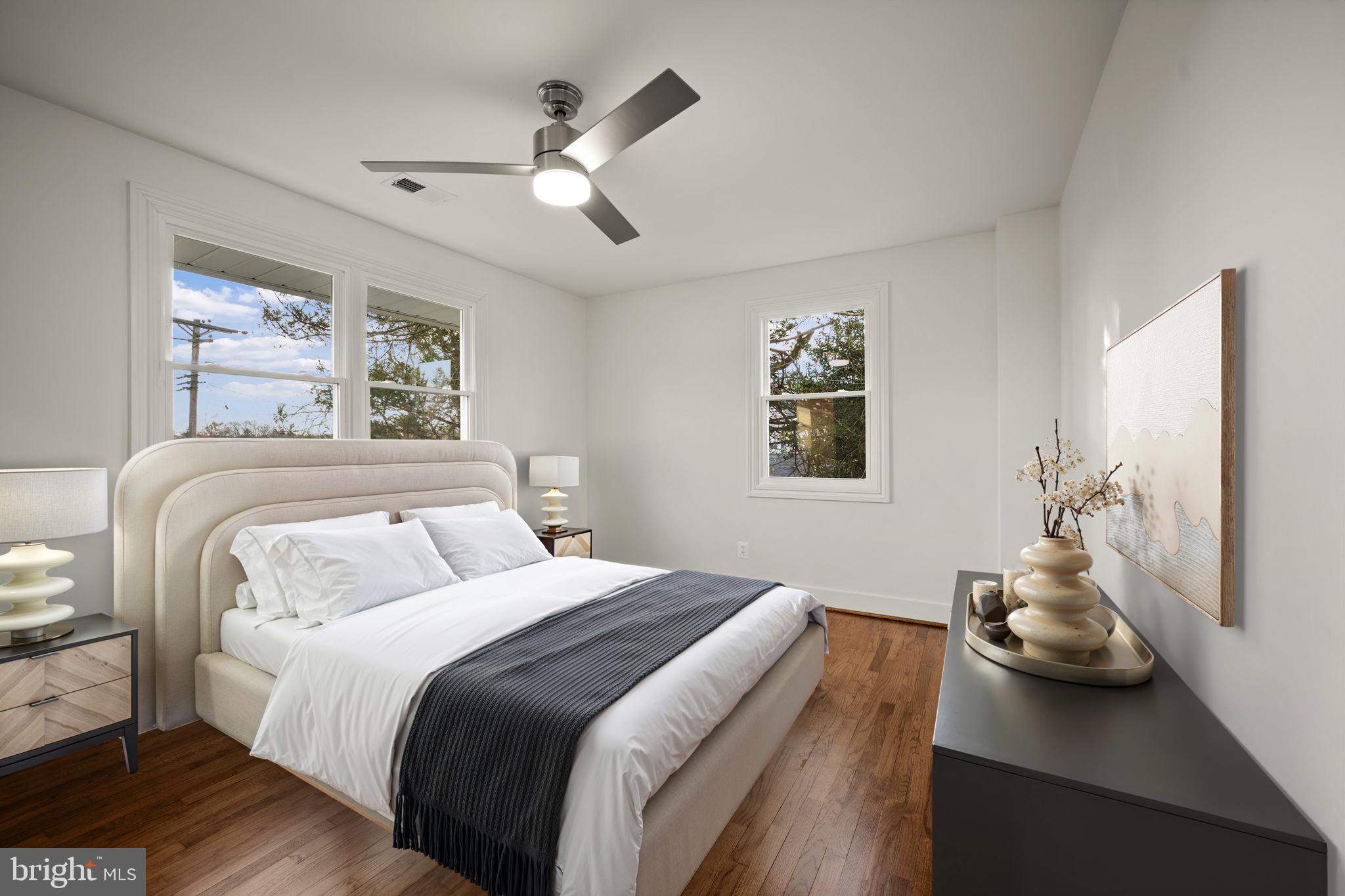 2111 Eastridge Road Lutherville-Timonium, MD 21093 - Photo 17 of 45 a bedroom with a bed and a chandelier