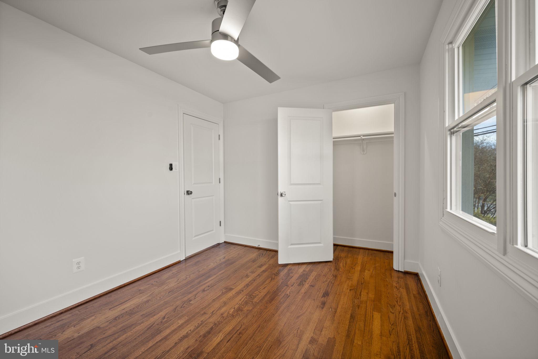2111 Eastridge Road Lutherville-Timonium, MD 21093 - Photo 24 of 45 wooden floor in an empty room with a window