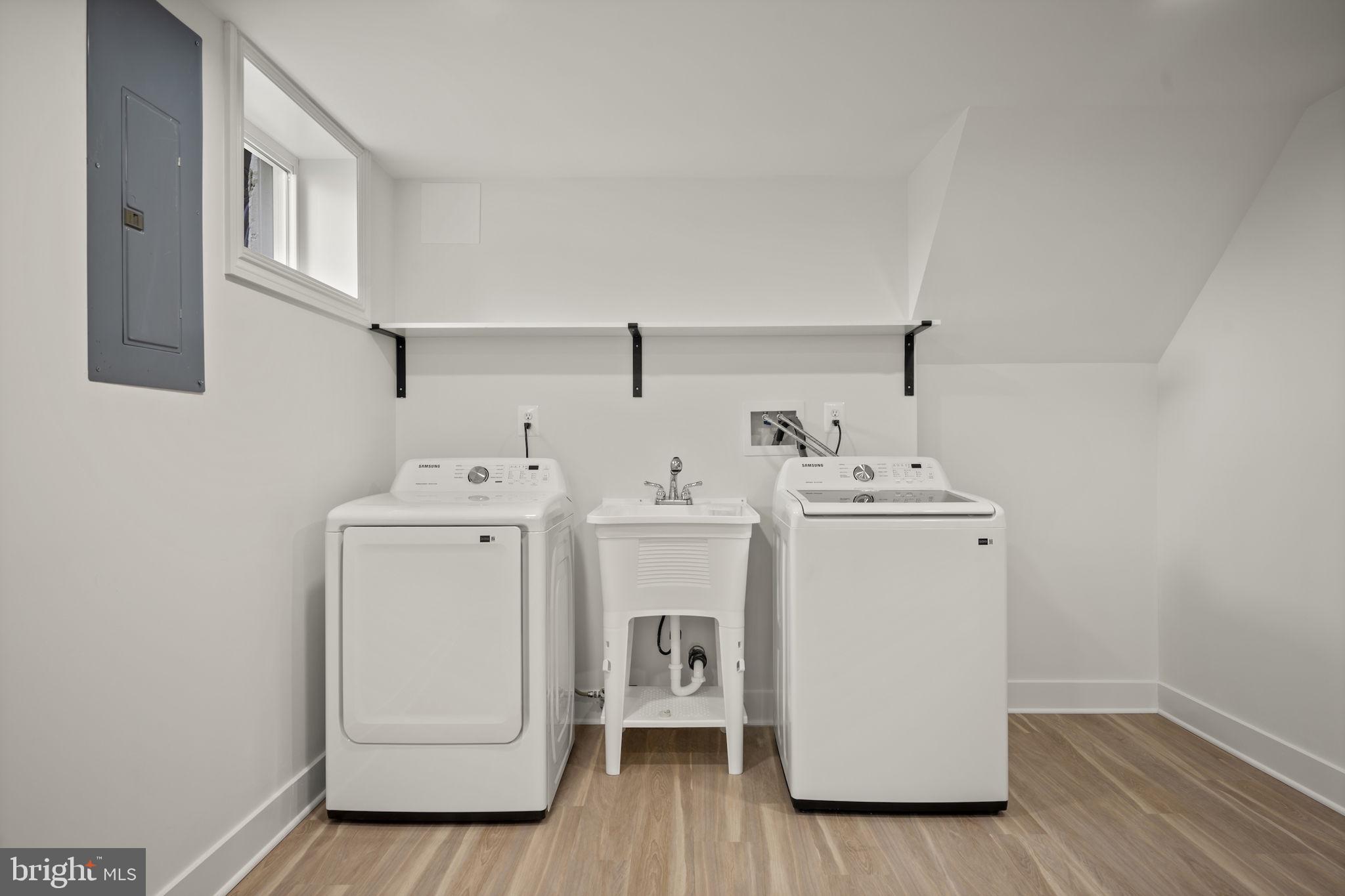 2111 Eastridge Road Lutherville-Timonium, MD 21093 - Photo 29 of 45 a utility room with cabinets washer and dryer