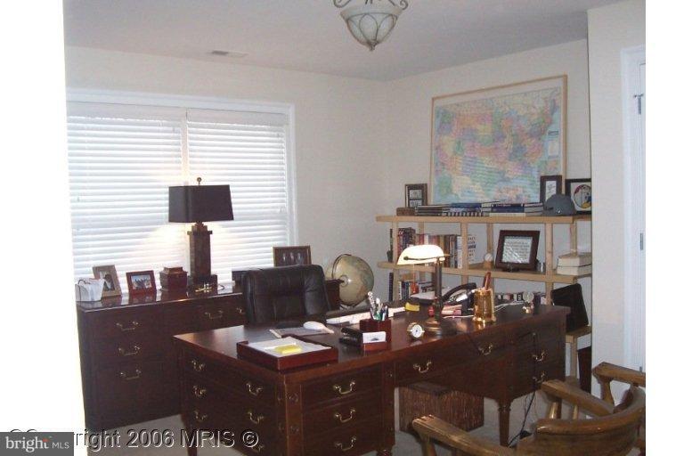 4416 Ridge Street Chevy Chase, MD 20815 - Photo 17 of 20 a view of a workspace with furniture