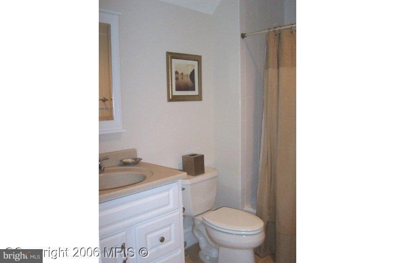 4416 Ridge Street Chevy Chase, MD 20815 - Photo 18 of 20 a bathroom with a toilet and a sink