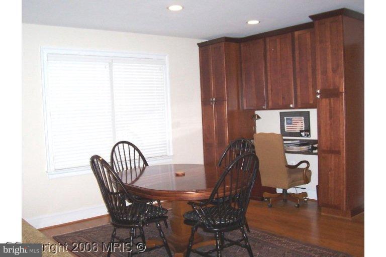 4416 Ridge Street Chevy Chase, MD 20815 - Photo 4 of 20 a view of a dining room with furniture and wooden floor